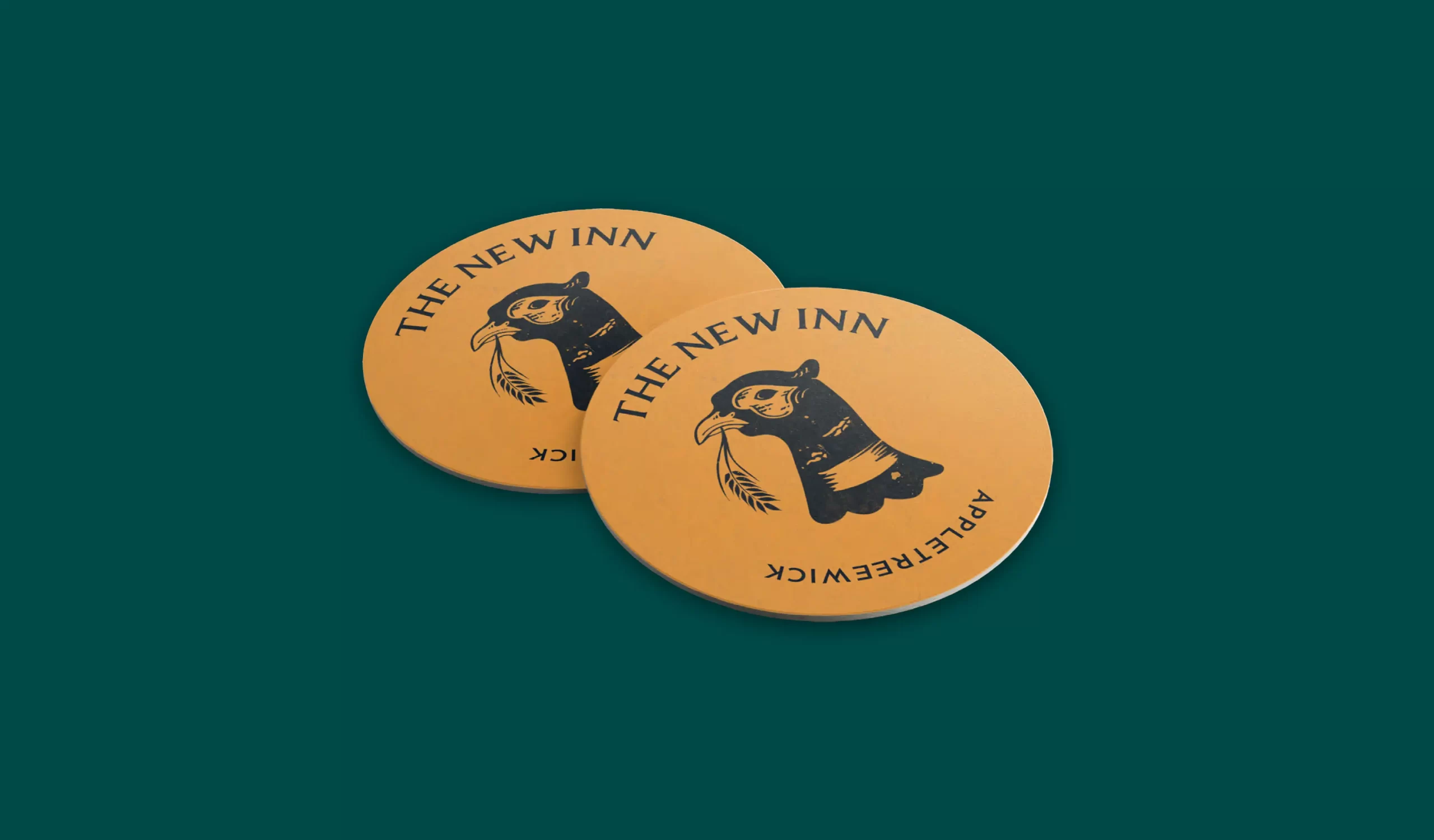 Appletreewick coasters with their logo design of a pheasants head