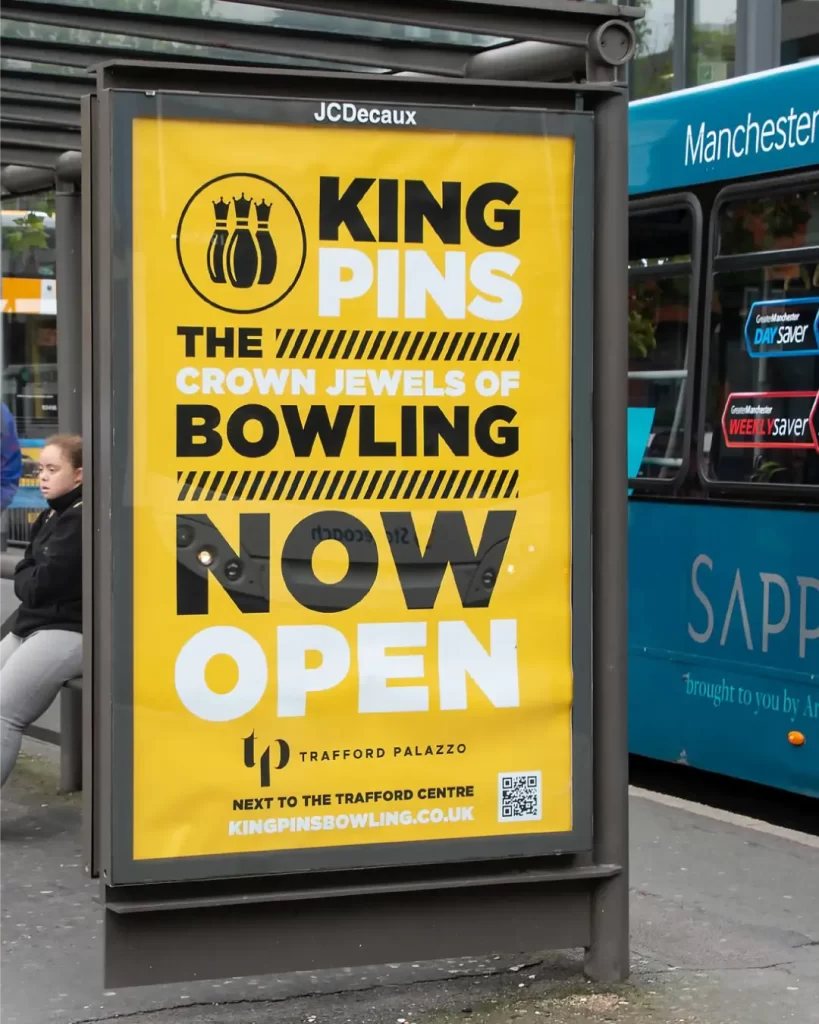 A king pins poster at a bus stop in manchester