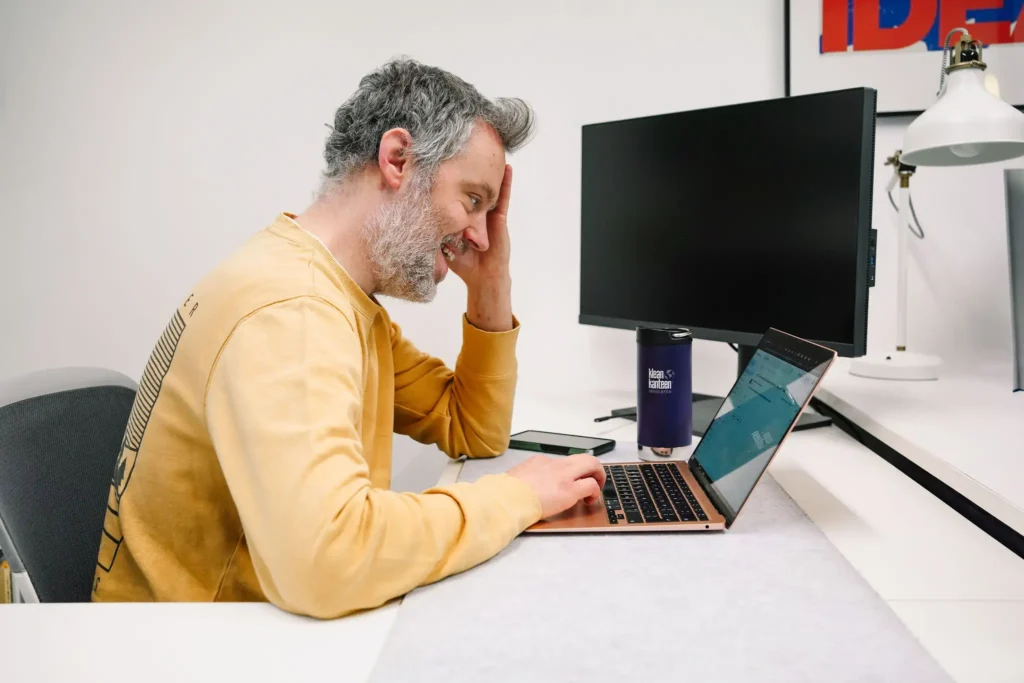 web developer working at his desk in the leeds design studio