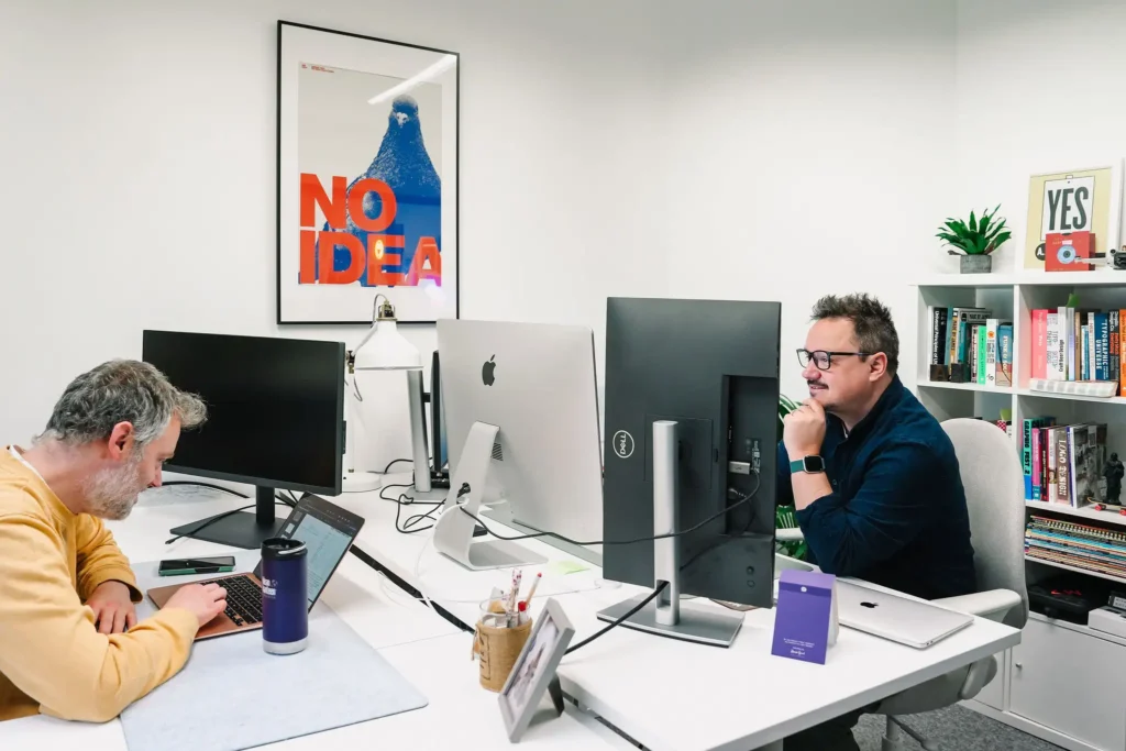 work colleagues in a design agency in leeds working at their desks