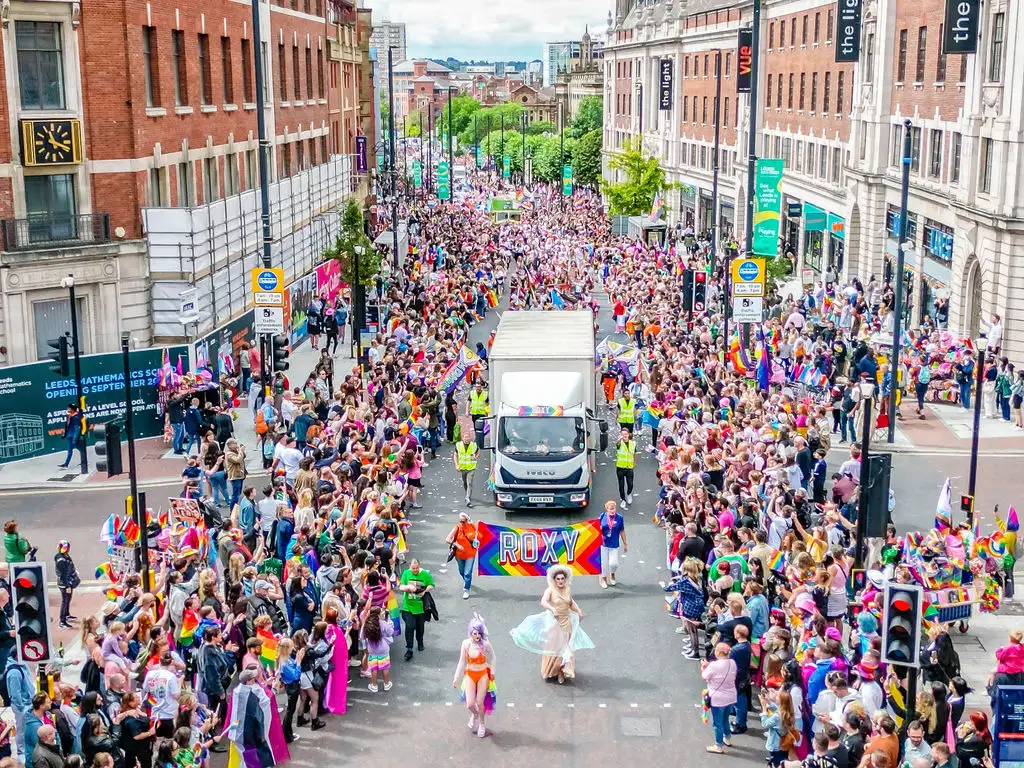 A birdseye photograph of a pride parade taken by a drone
