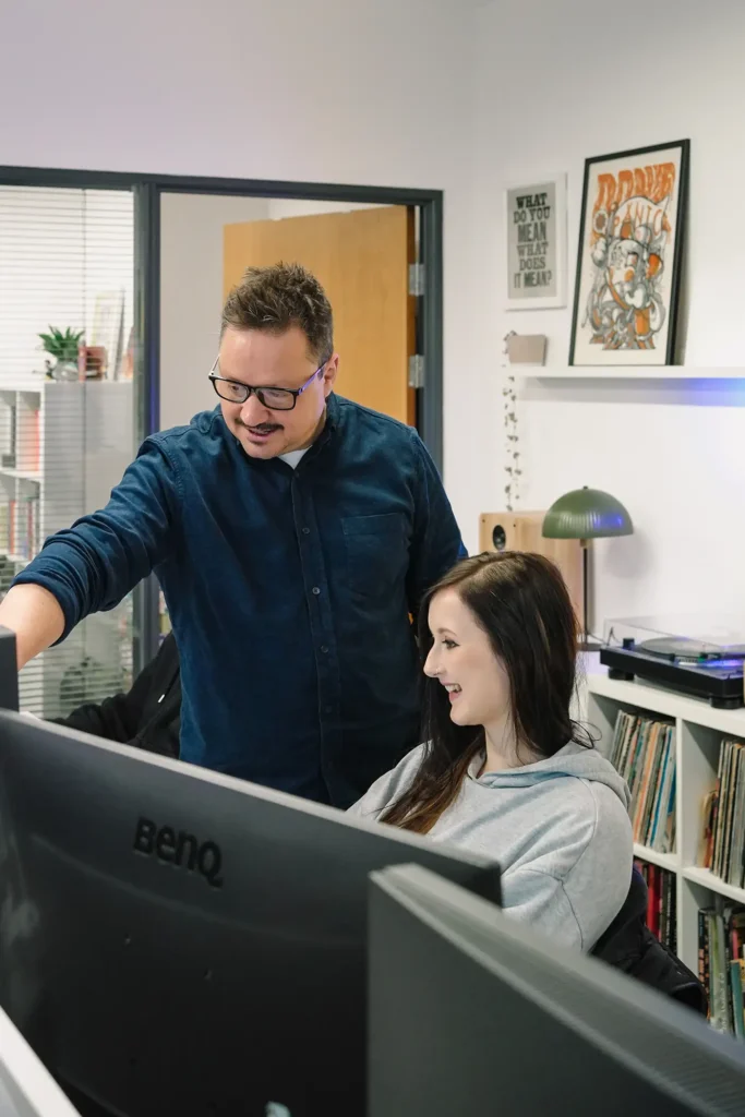 competitive-socialising-web-design-web designers discuss project in office